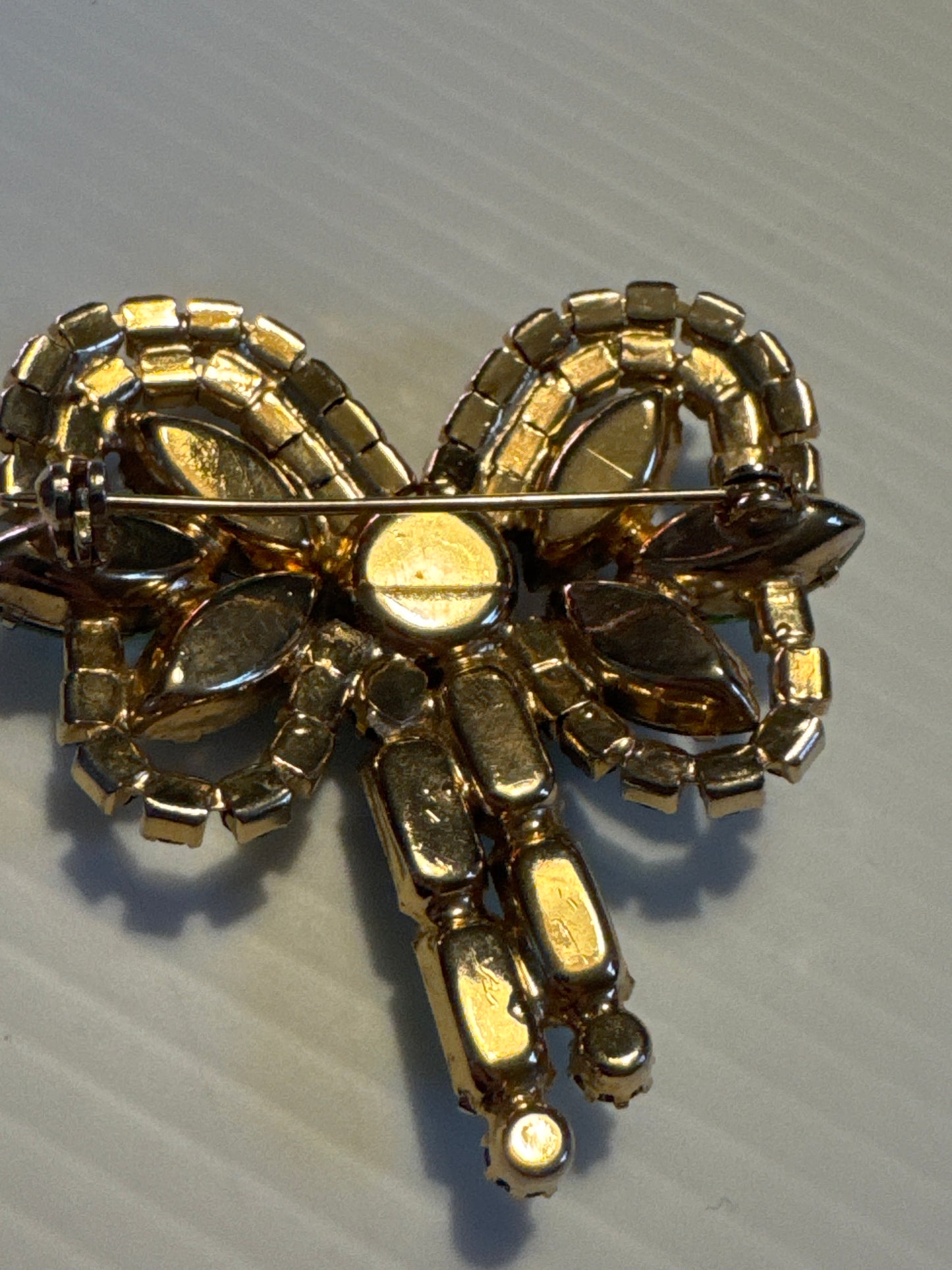 Beautiful 1950s shades of green bow brooch with aurora borealis