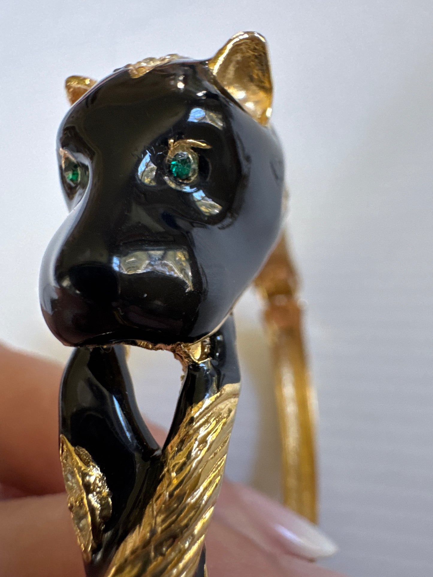 1980s vintage panther bracelet with black enamel, green rhinestone eyes and clear rhinestones