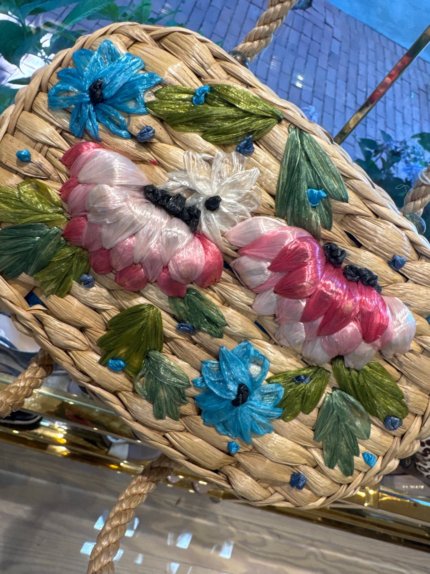 Beautiful 1960s wicker bag with pink yellow and turquoise flowers. Rope handle.