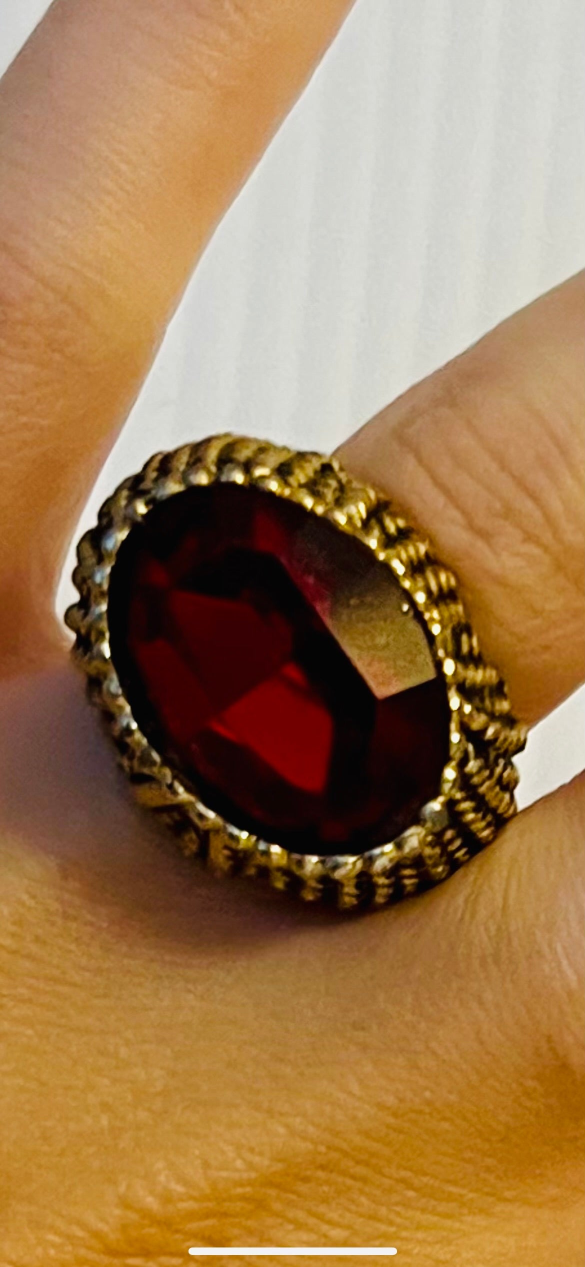 Vintage brass tone ring with ruby like gem