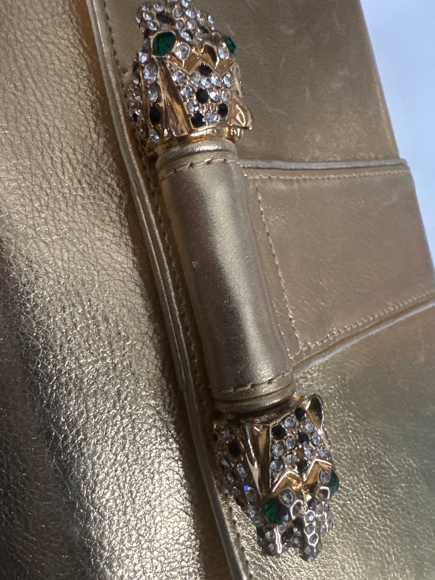 Beautiful 1970s signed Kenneth J Lane gold lambskin convertible clutch with two rhinestone tiger eyes