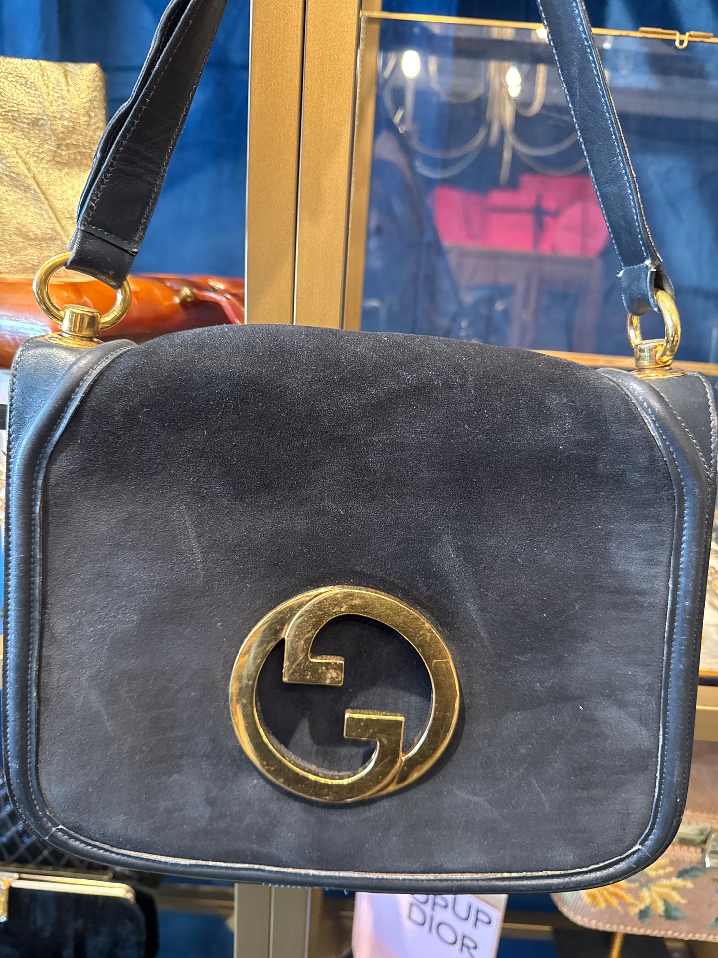 An original 1970s Gucci Blondie bag in midnight blue suede with gold double GG. Snap closure recently replaced.