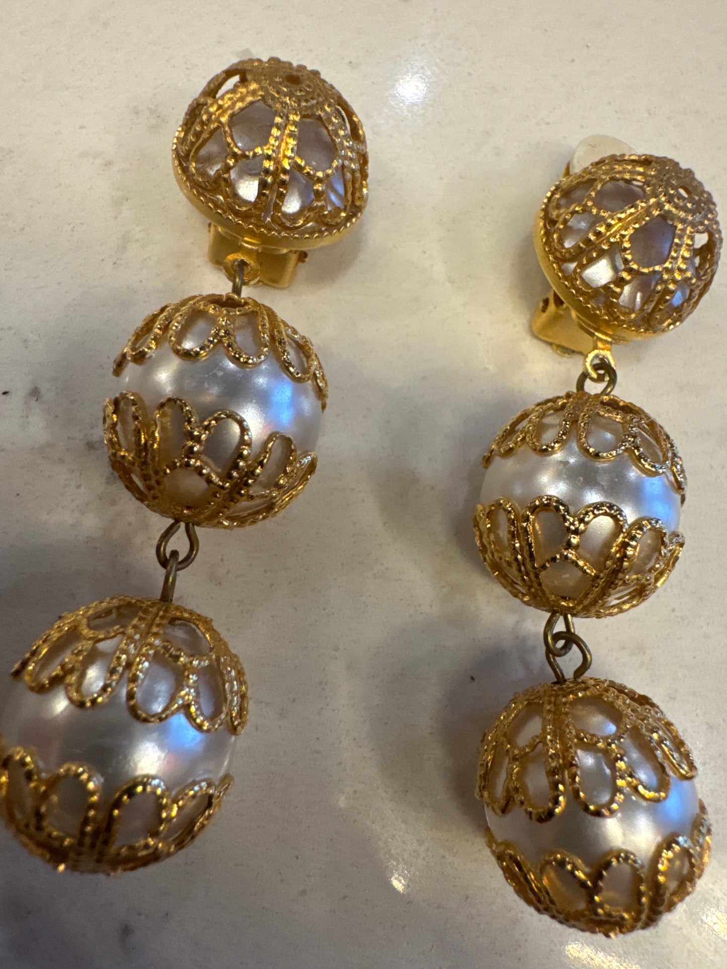 Stunning 1950s pearl and gold tone dangler clip on earrings. NYC