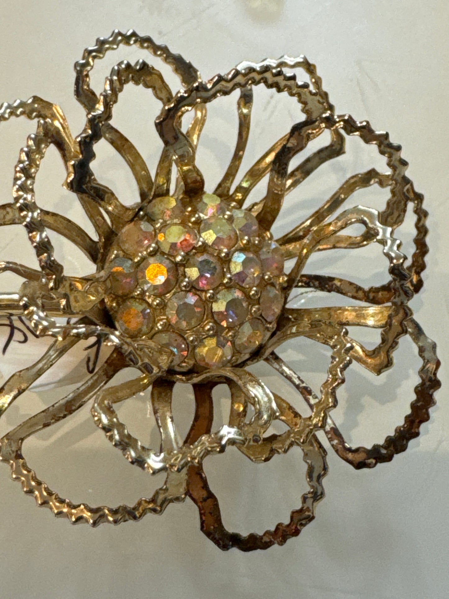 Beautiful jumbo sarah Coventry flower brooch in gold town with aurora borealis center