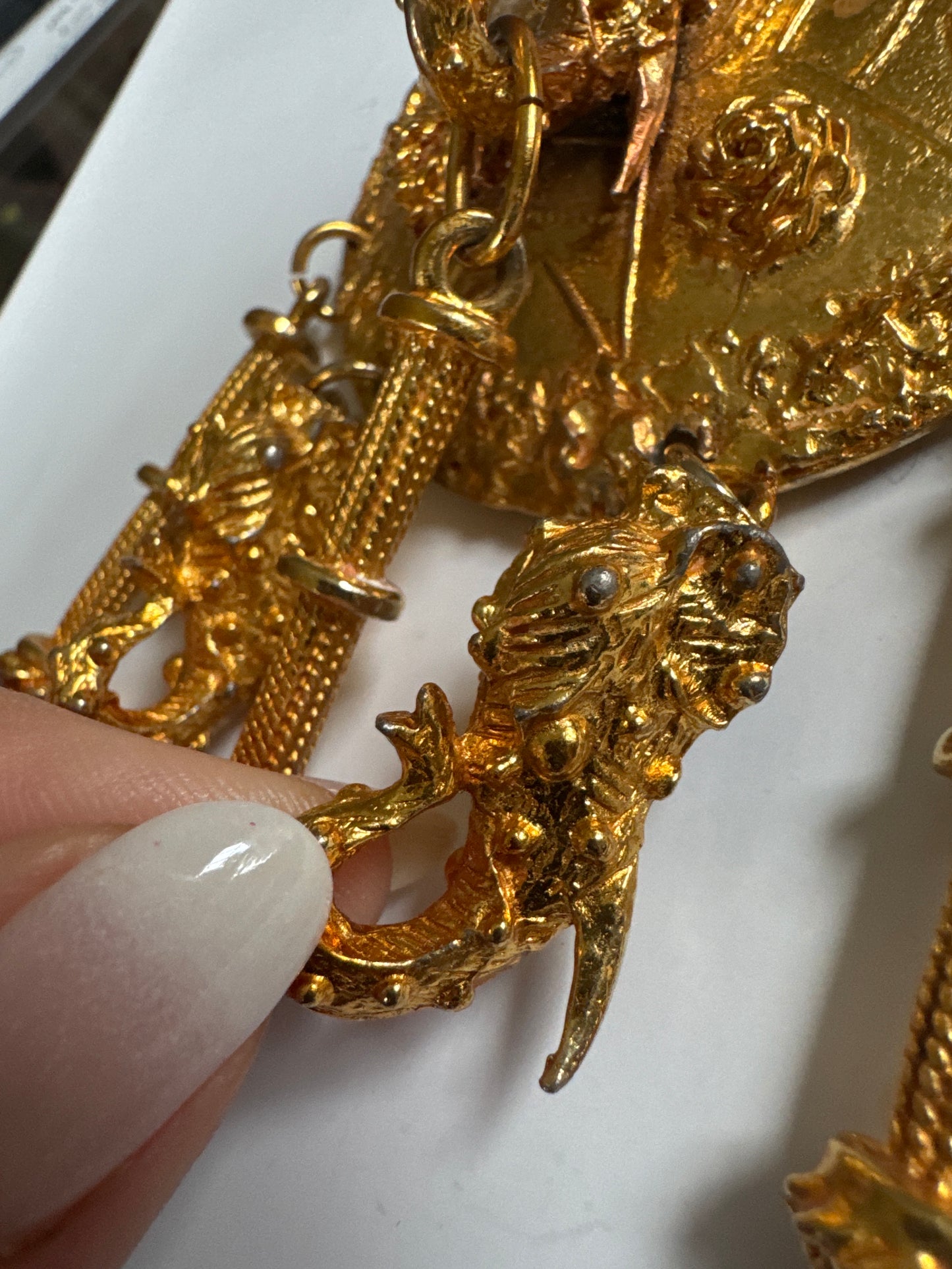 Signed 1960s Pauline Rader signed gold tone necklace. The two elephant heads that dangle at the bottom of the pendant are hollow. Double chains on each side. It's heavy!