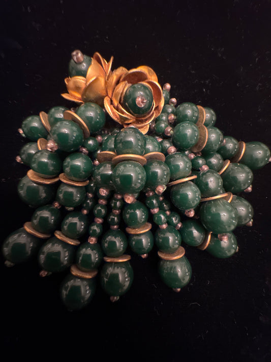 Beautiful vintage fur clip with green glass beads and gold tone flowers