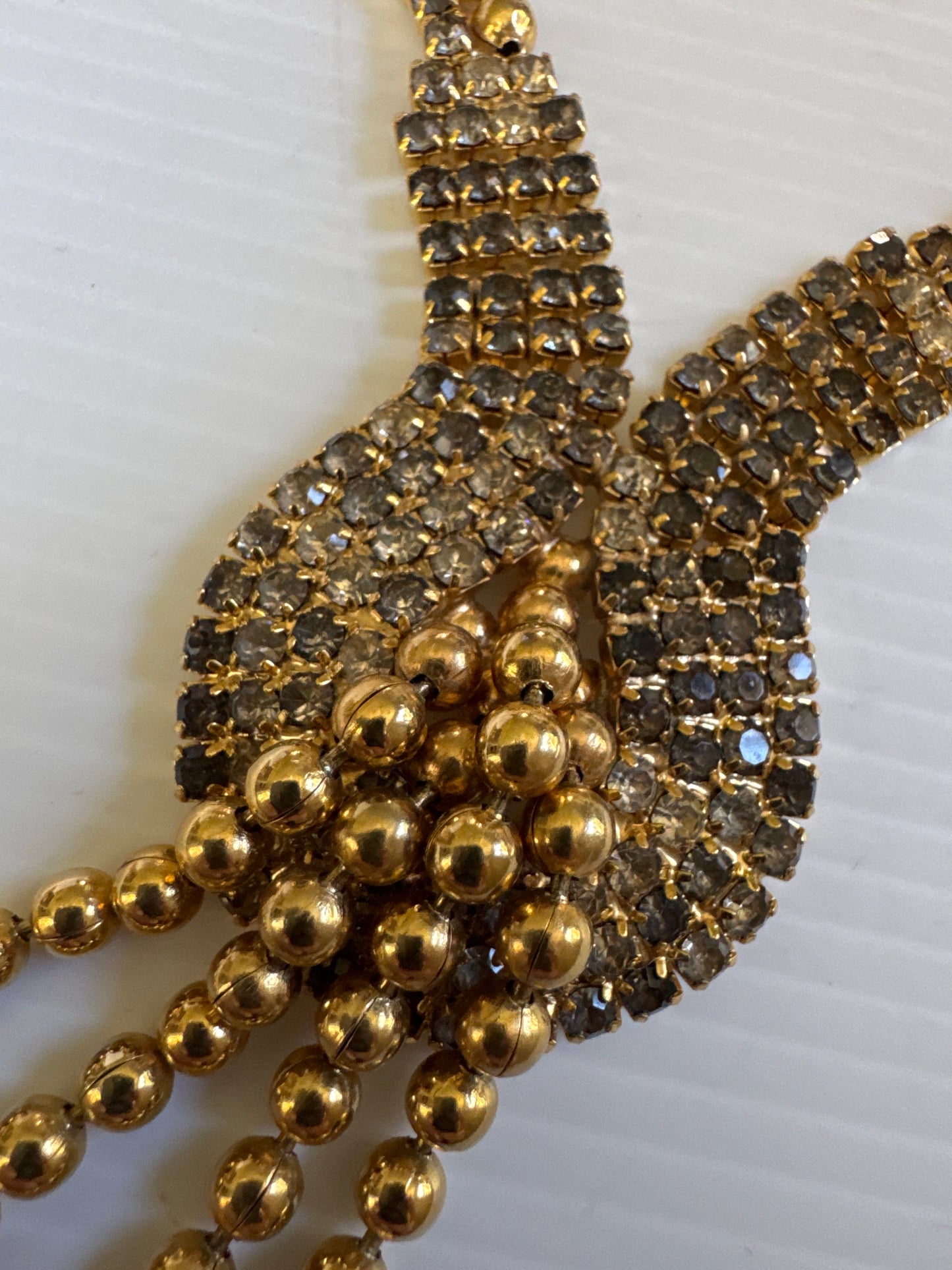 vintage necklace with gray and clear, rhinestones and gold tone ball tassel