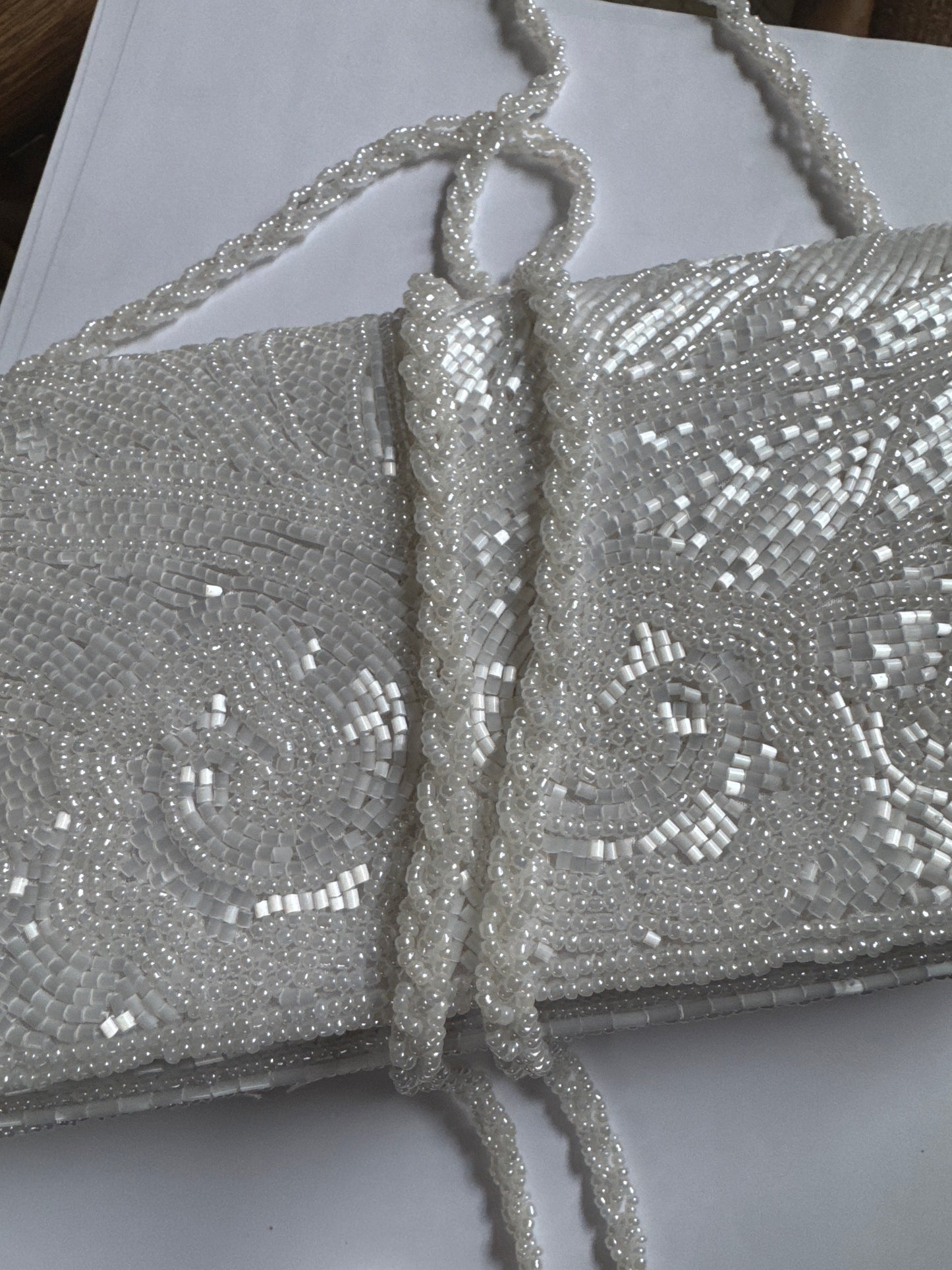 Beautiful 1980s/nineties beaded clutch with optional strap. Secret note and lace hanky tucked inside. Comes in original box.