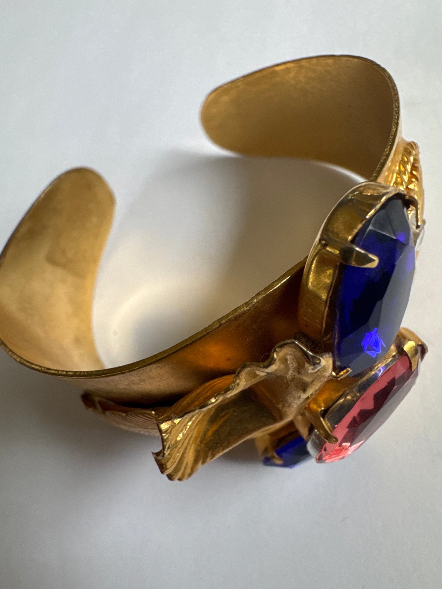 Statement 1980s decorative cuff bracelet in gold tone with blue and pink rhinestones