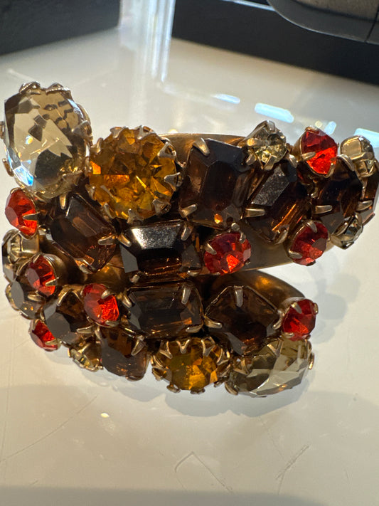 Vintage 1950s Juliana clamper bracelet featuring Amber, Orange, and root beer colored stones along with smoky gray topaz