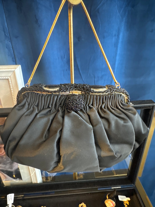 Beautiful 1930s satin black opera bag, with delicate chain and beautiful black beading and flower cameo detail at closure