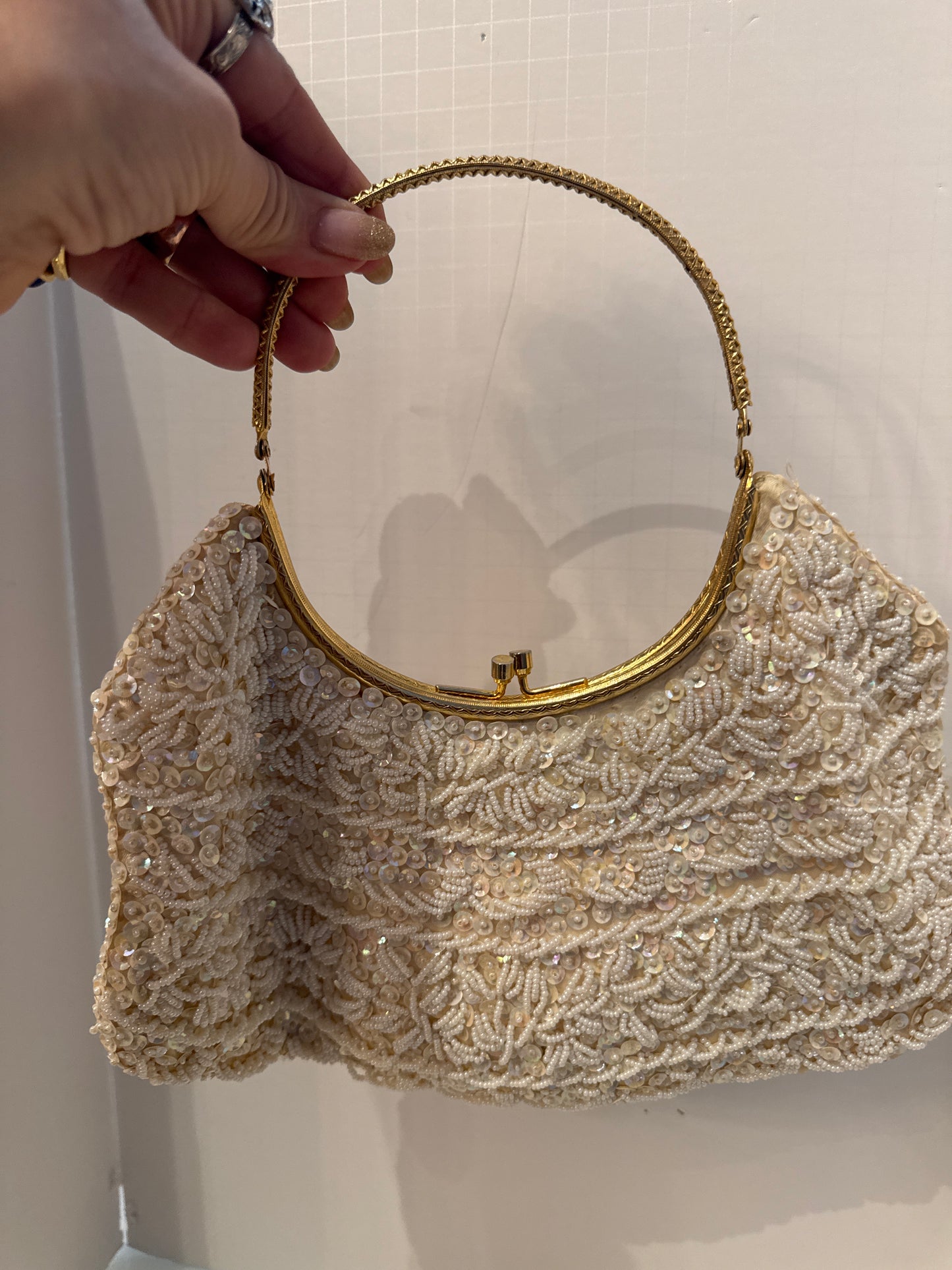 1950s white beaded kiss lock bag with gold bracelet handle