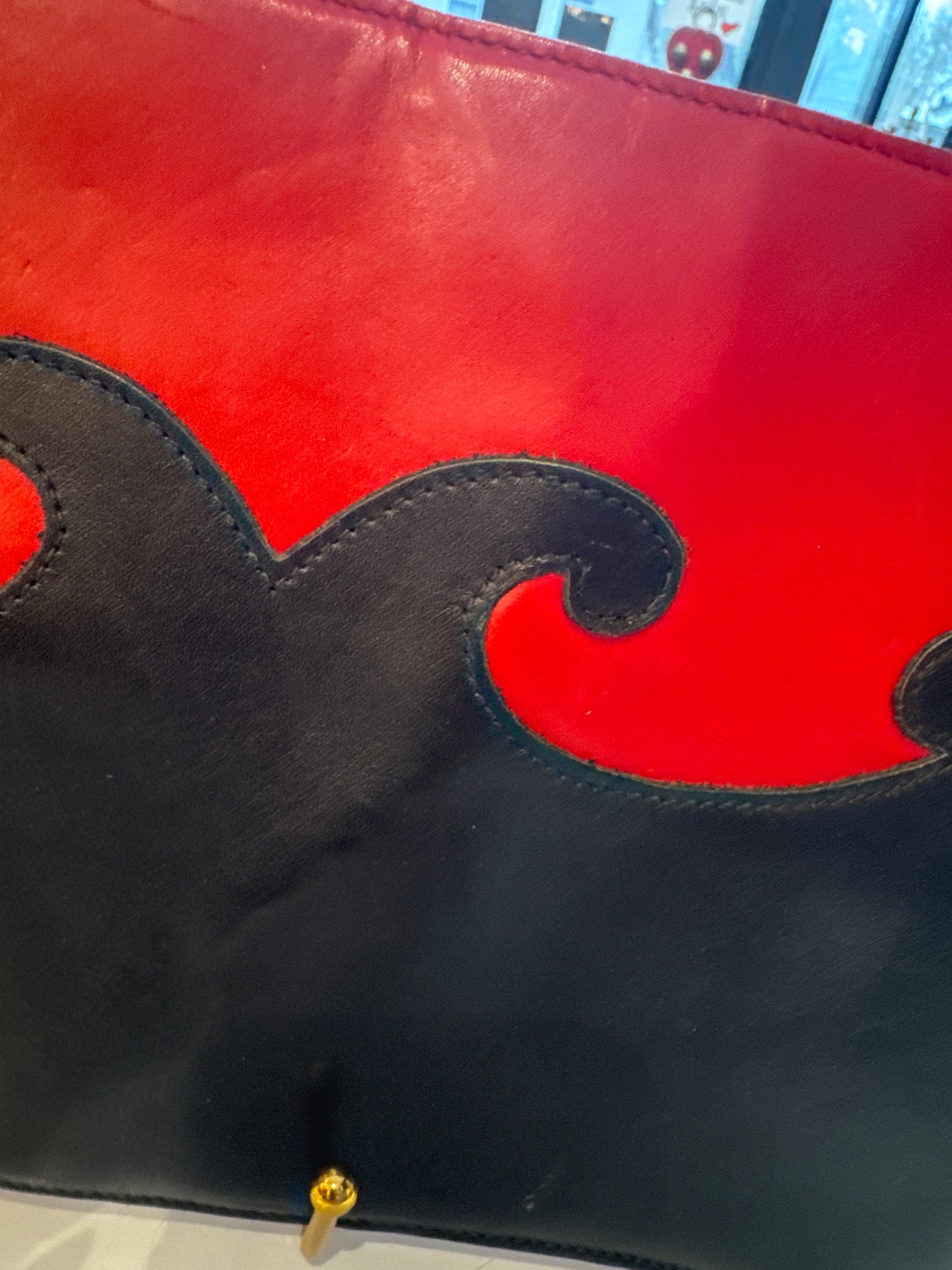 stunning vintage 1980s buttery leather CHRISTIAN LACROIX clutch bag in red and black with jewel zipper pull