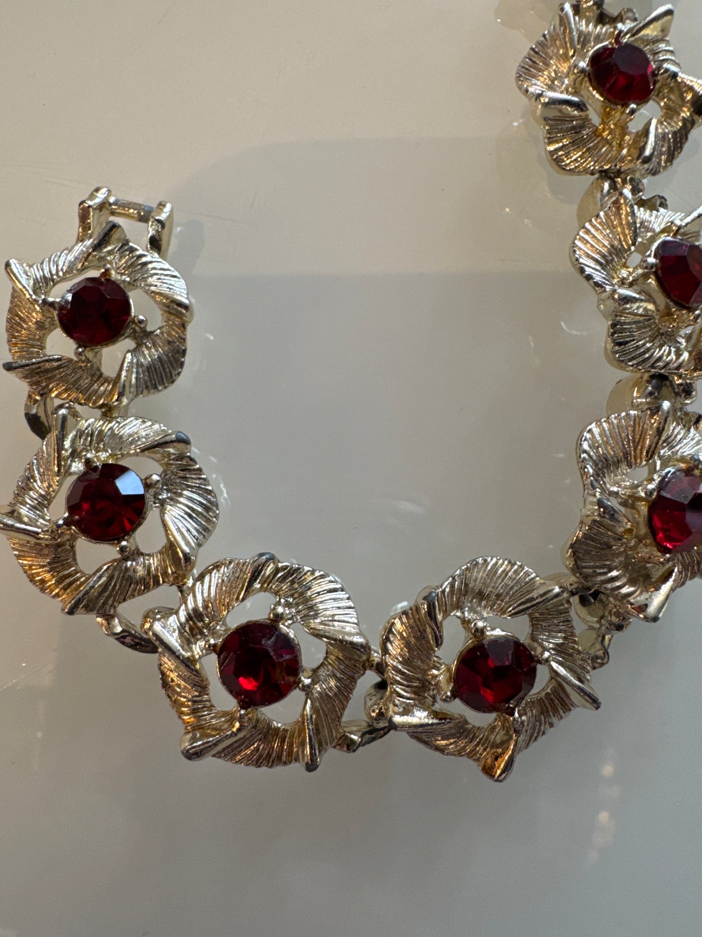 Vintage silver tone bracelet with red rhinestones