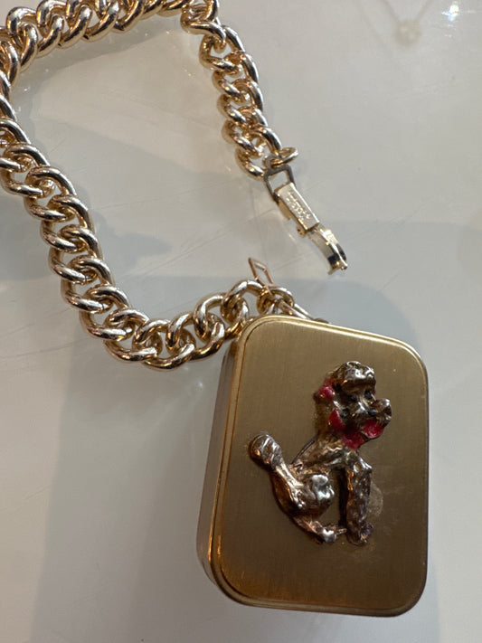 1960s poodle music box charm bracelet. Music back wines, but no longer plays .signed made in Germany.