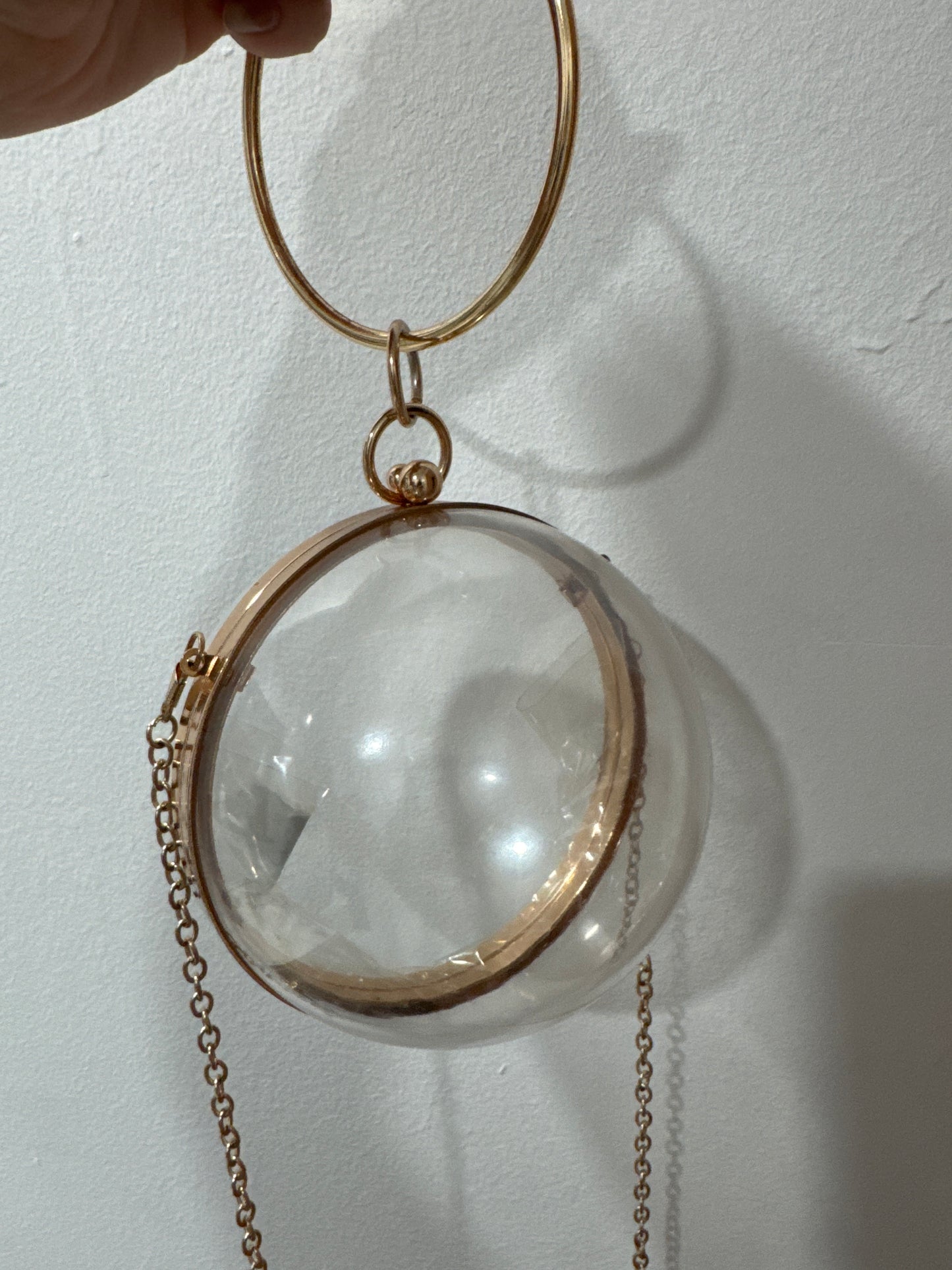 Fun 1980s mod bracelet/crossbody lucite bag with gold tone trim. crossbody strap is removable.