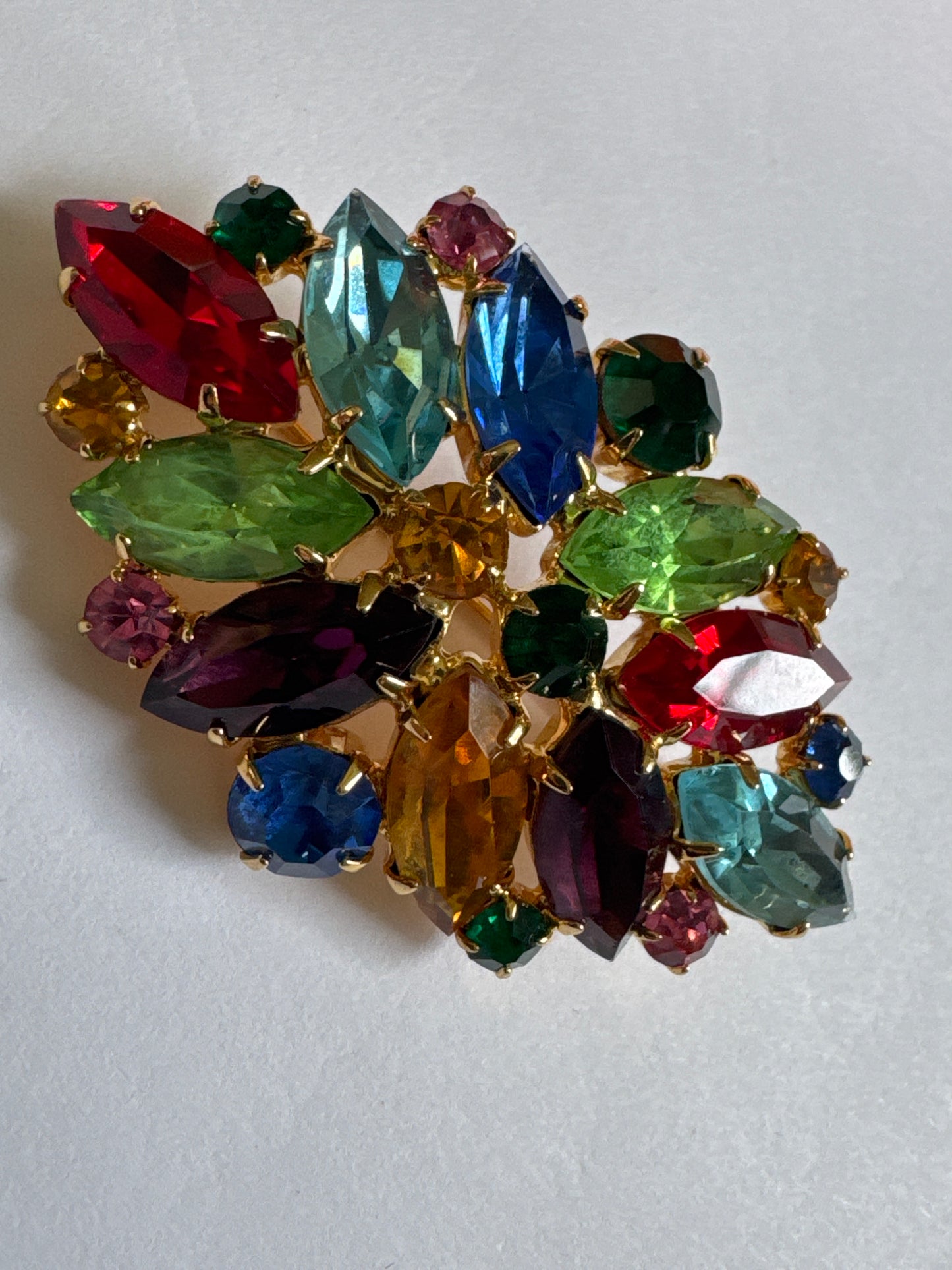 1960s cheerful and colorful, fruit salad brooch featuring colored navette rhinestones