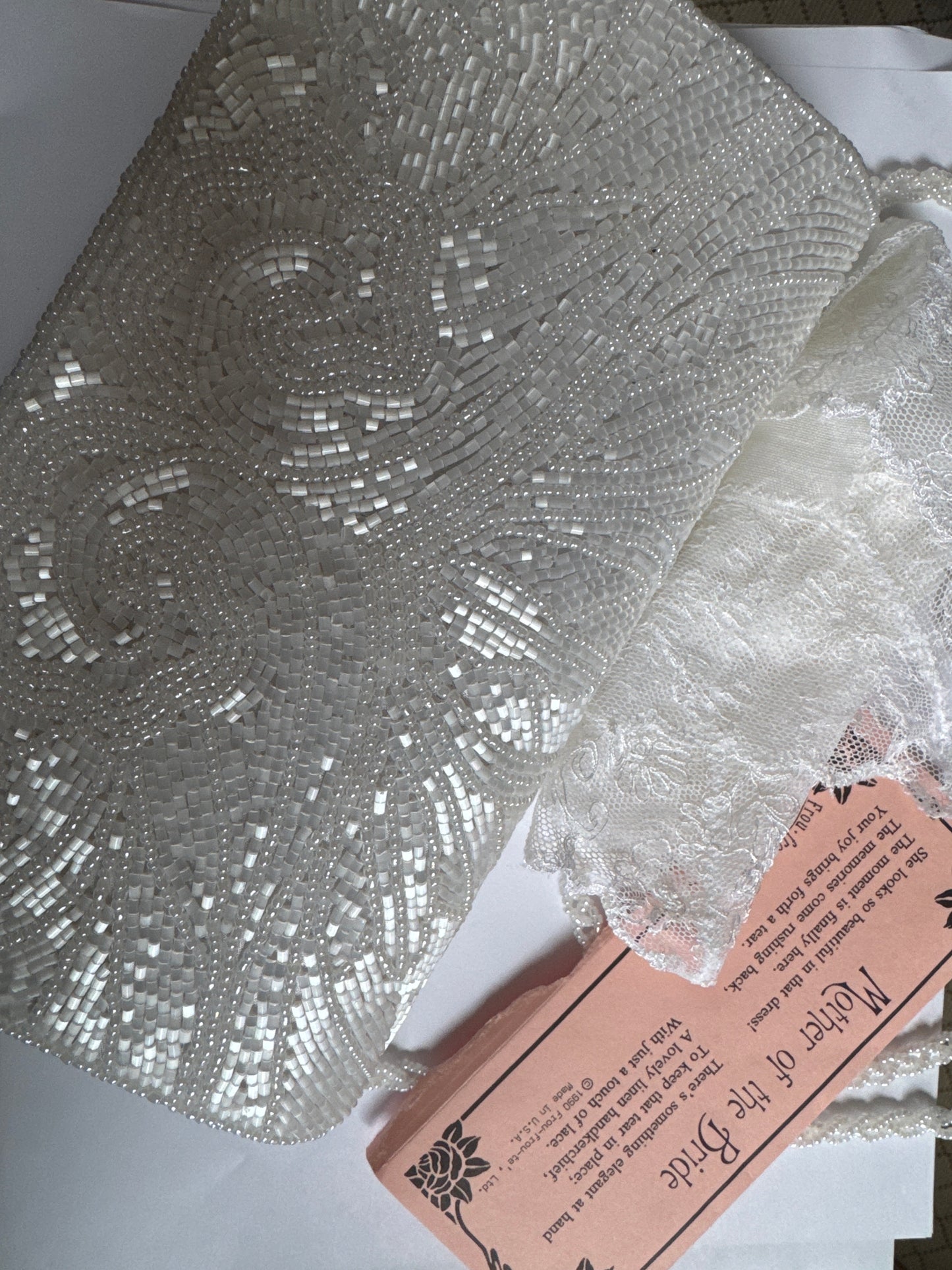 Beautiful 1980s/nineties beaded clutch with optional strap. Secret note and lace hanky tucked inside. Comes in original box.