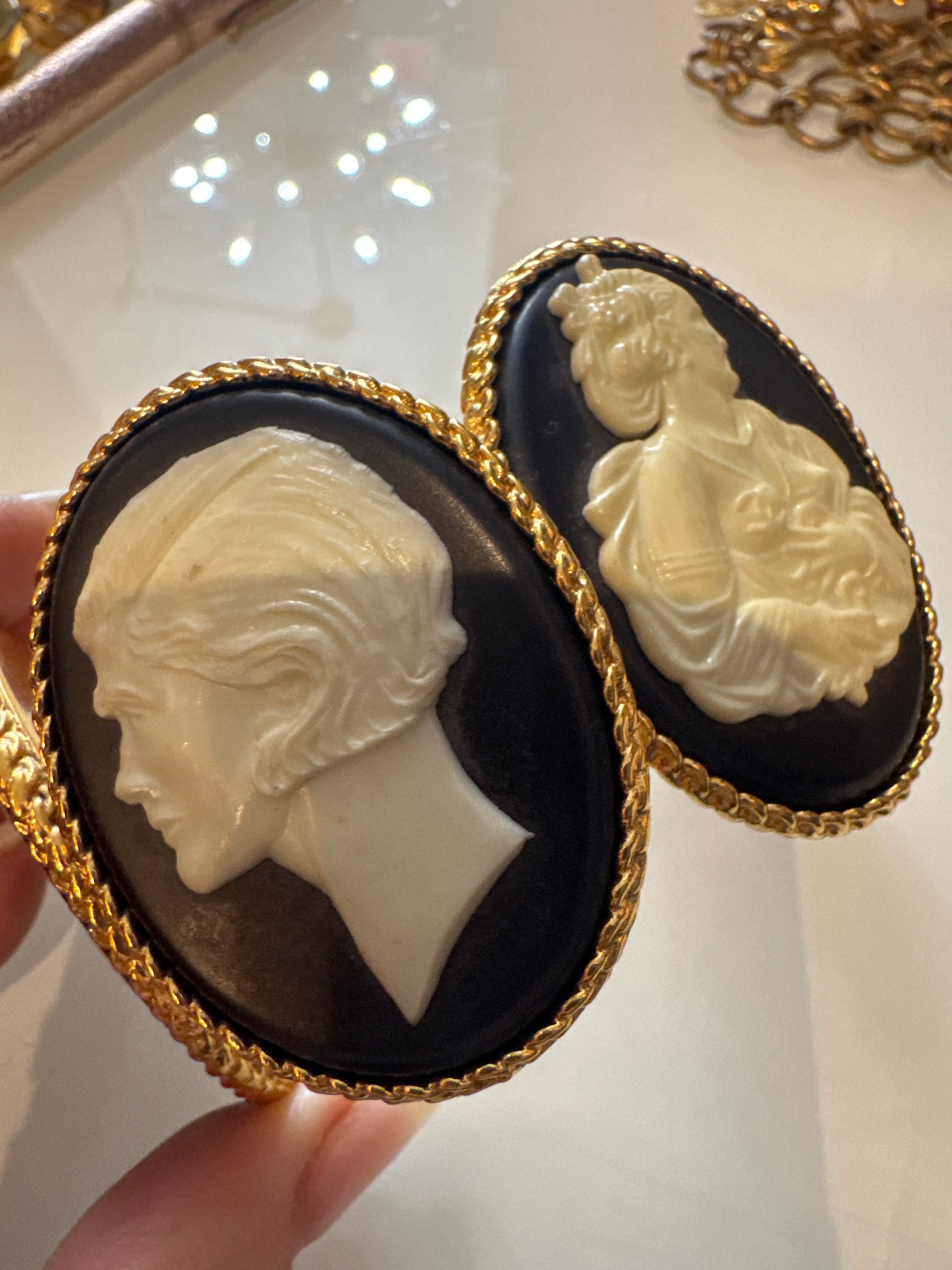Chanel 1990s carved cameo motif large cuff bracelet with 4-cameo 2" cameo plates featuring a horse, 2 Coco portraits and a renaissance girl.