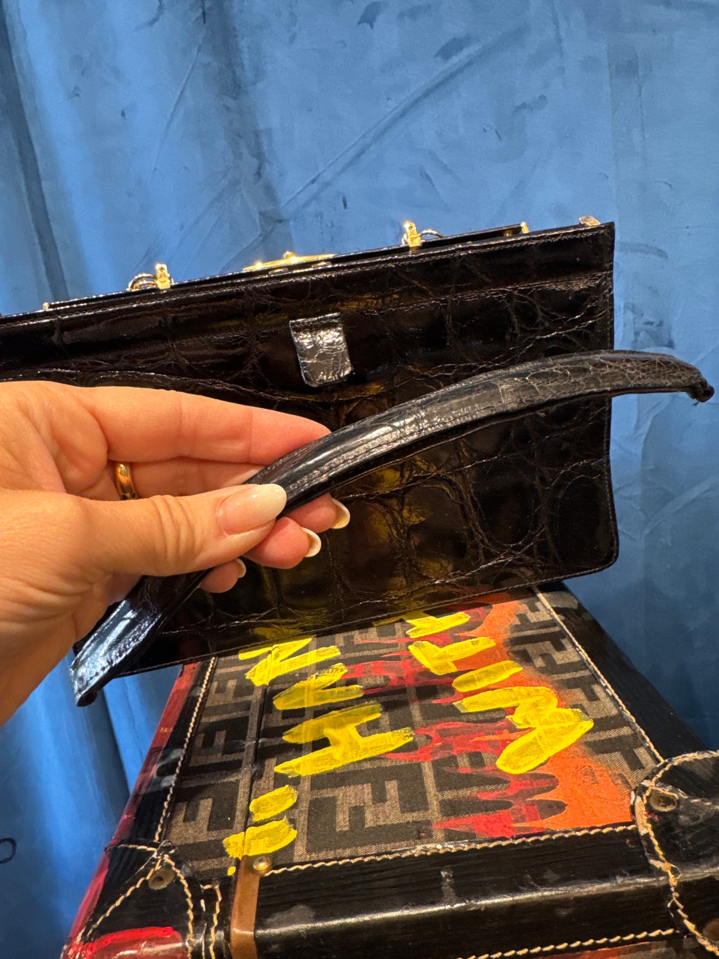 1960s vintage black alligator bag in beautiful condition, with lightweight gold shoulder chain. Original alligator top handle is inside bag. Made in France