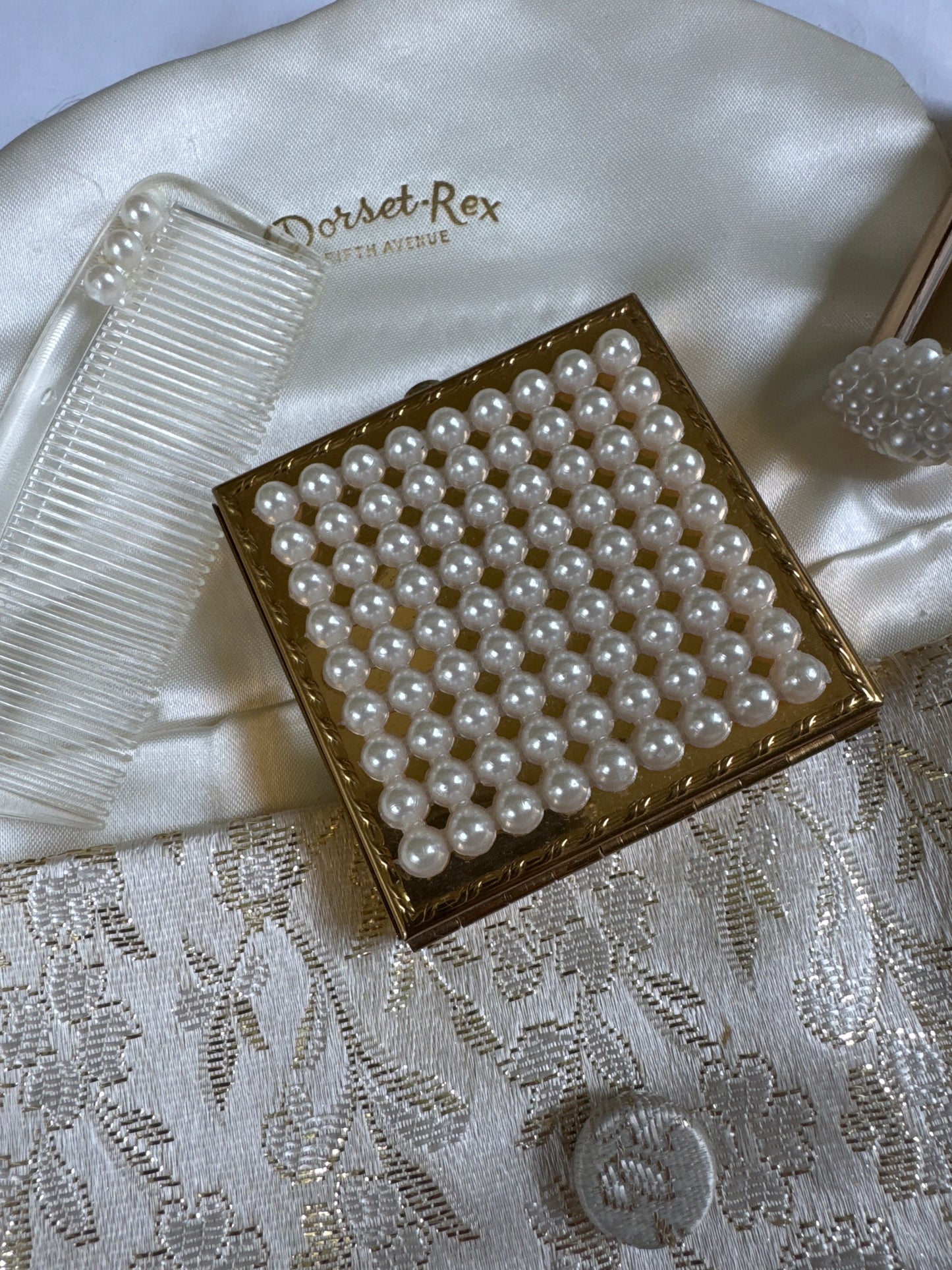 Vintage Dorset Rex 5th Ave makeup compact, lipstick holder, comb and pouch
A rare 4 piece unused cosmetics set