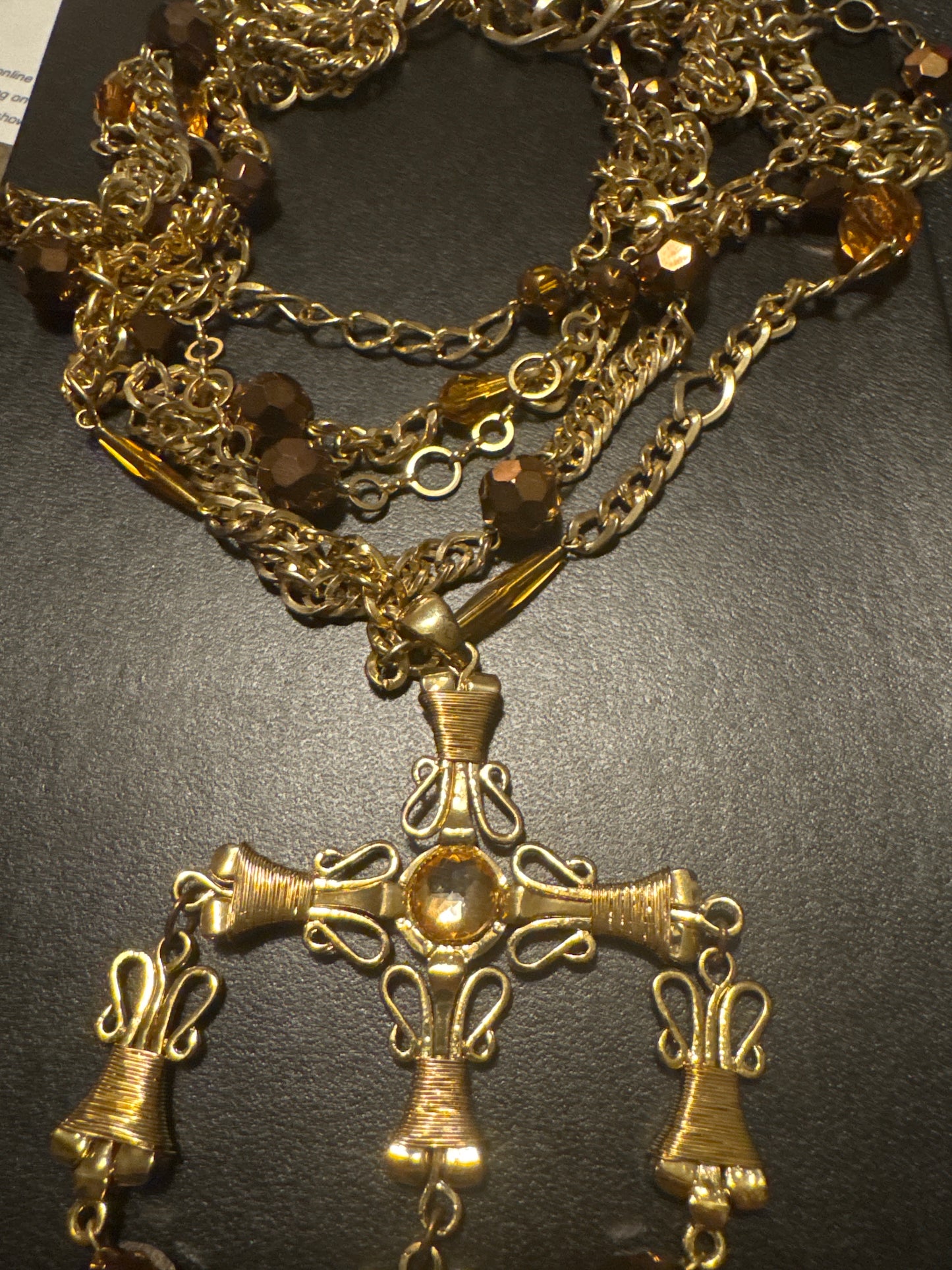 1970s multi strand, signed Scaasi in gold tone with bronze colored beads