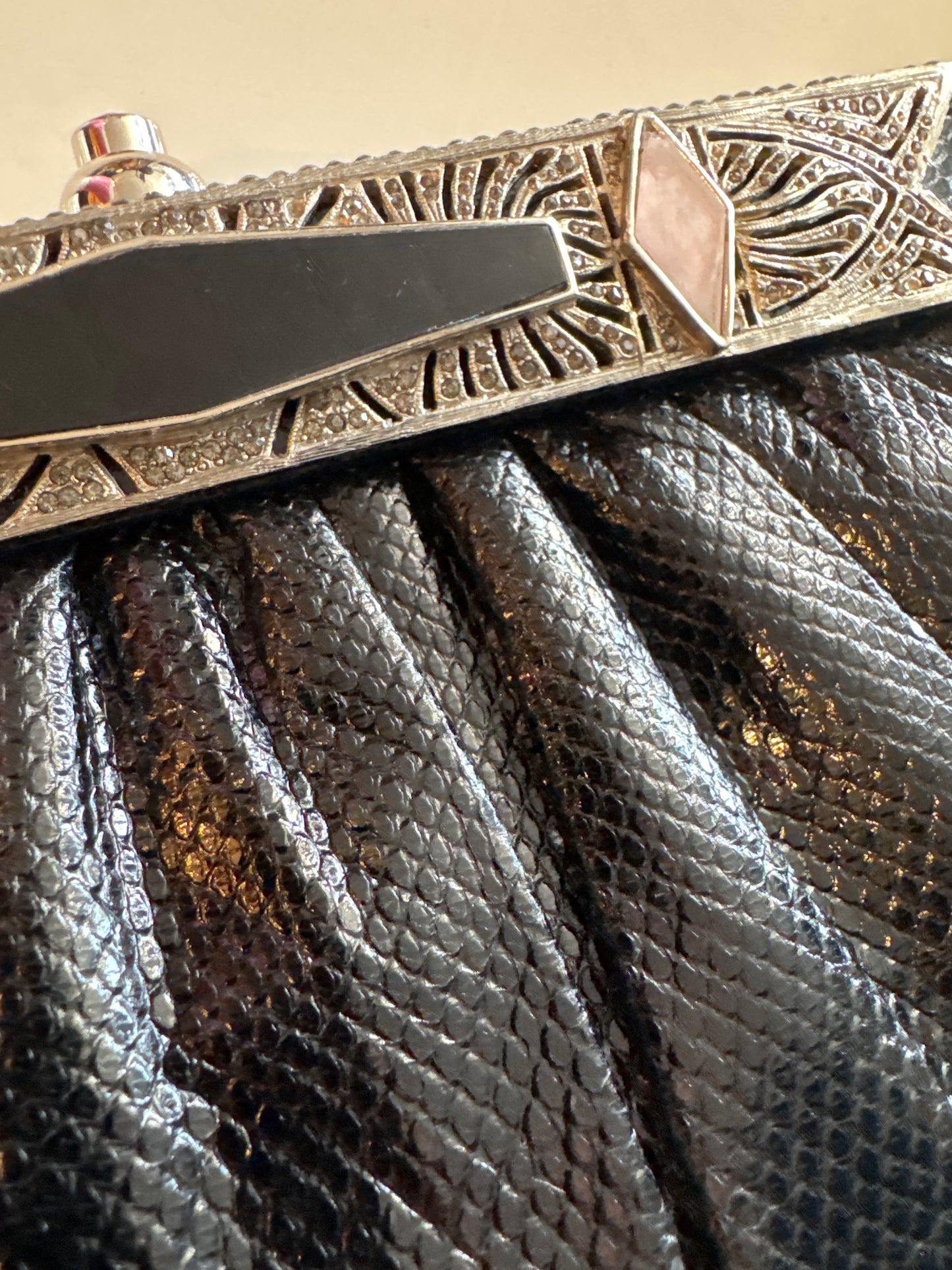 1980s gorgeous Black Judith Lieber with Art Deco, inspired and crusted jewels, including black and pink enamel and rhinestone detail. Silver attached shoulder chain.