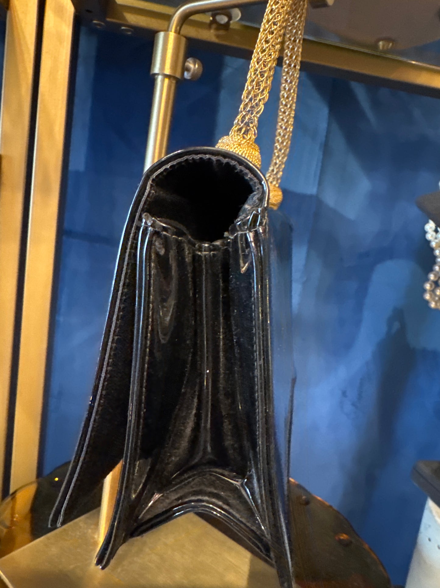 Beautiful 1950s patent leather top handle bag with gold filigree handle. Absolutely stunning