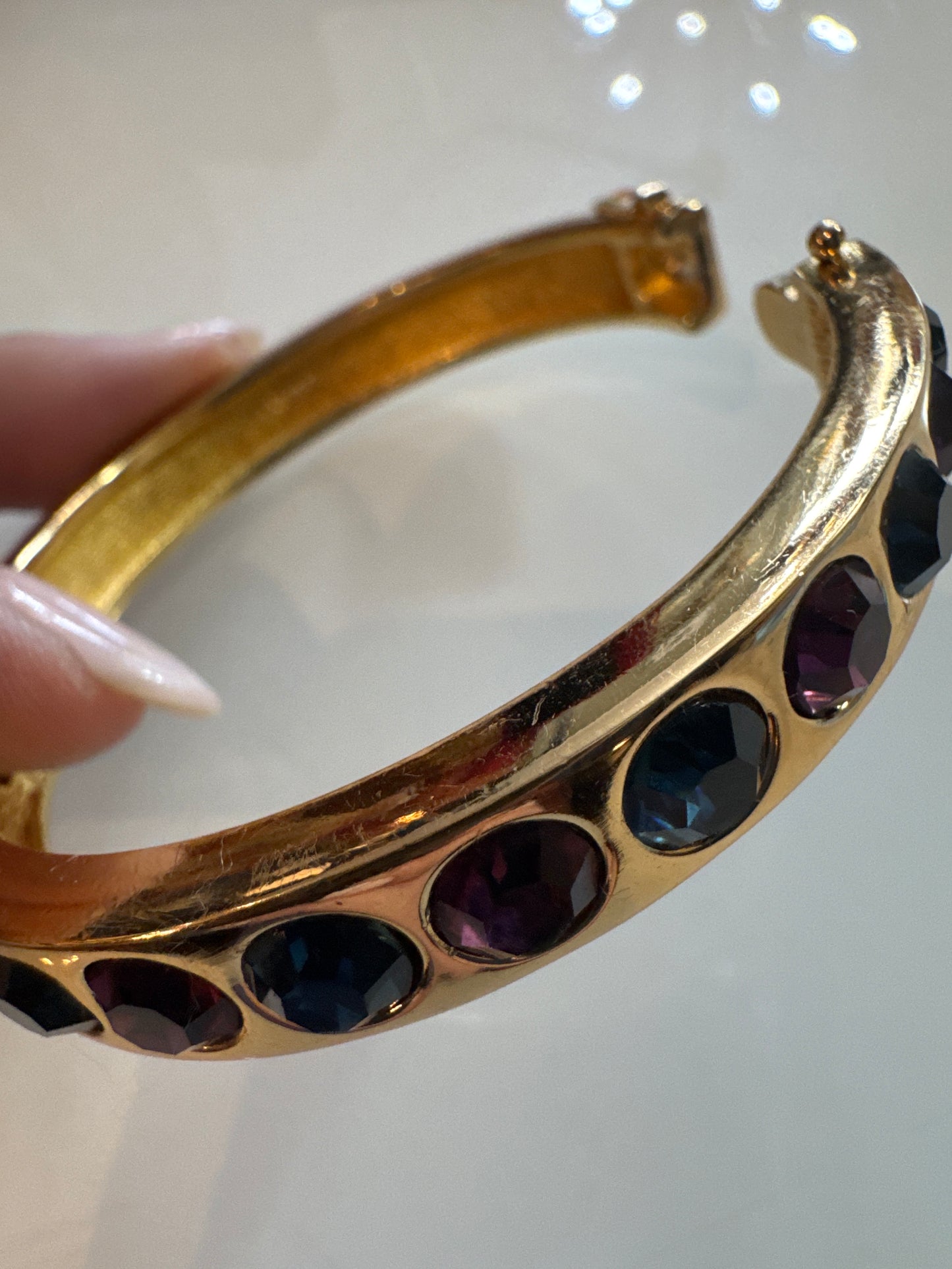 Beautiful 1990s vintage Dior clamper bracelet with blue and purple rhinestones and safety latch