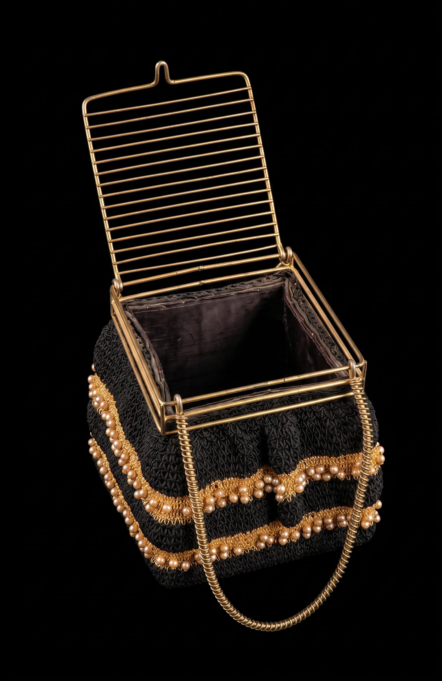 1940s crochet box bag in black with gold threading and pearls and a cage-like  top
