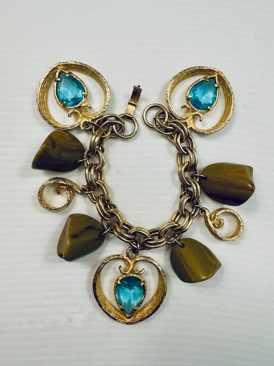 Jumbo 1970 gold tone charm bracelet with light blue charms and brown lucite beads