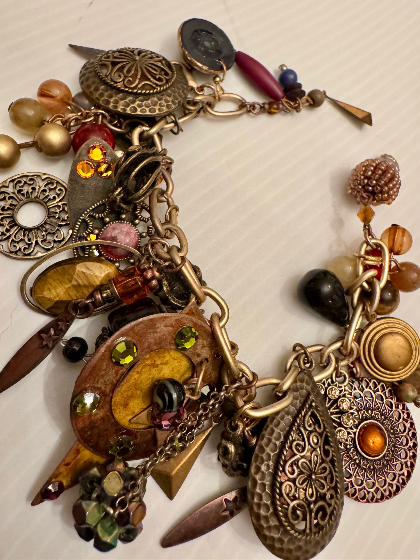 Fully loaded vintage charm bracelet chock full of bronze color charms