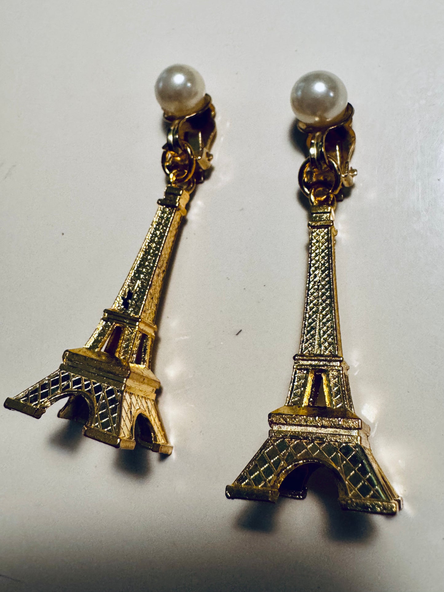 Vintage clip on Eiffel Tower with pearl earrings. From the collection of Linda Fargo