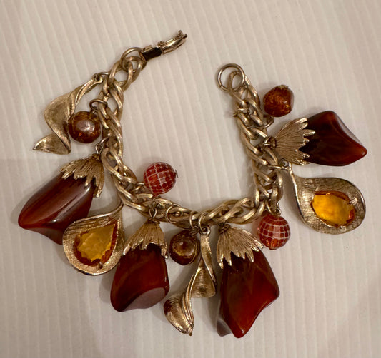 Vintage chunky charm bracelet from 1960s light and dark honey lucite beads with goldtone chain