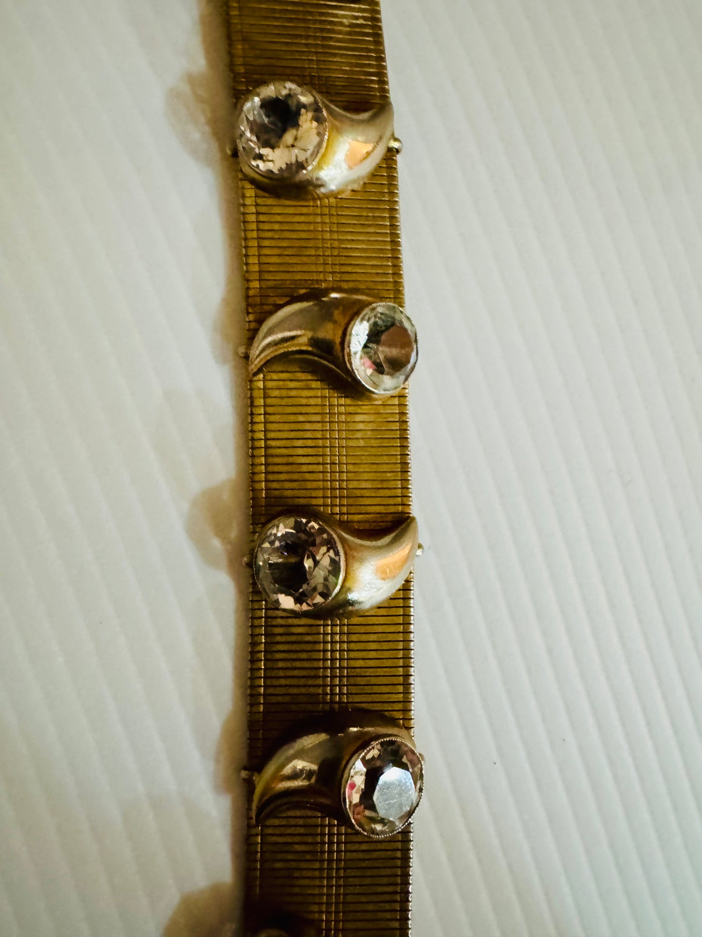 Vintage 1960s gold tone bracelet with rhinestone motifs. Oscar worthy!