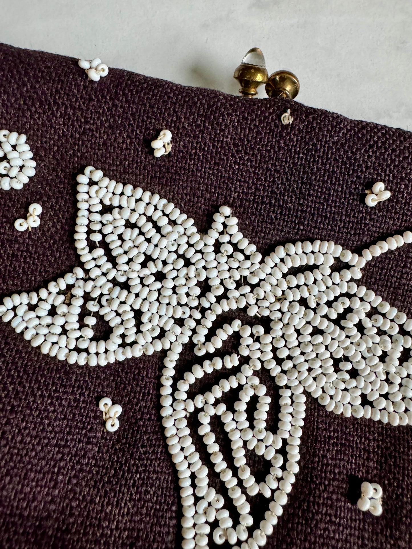 Small black silk clutch with white beading