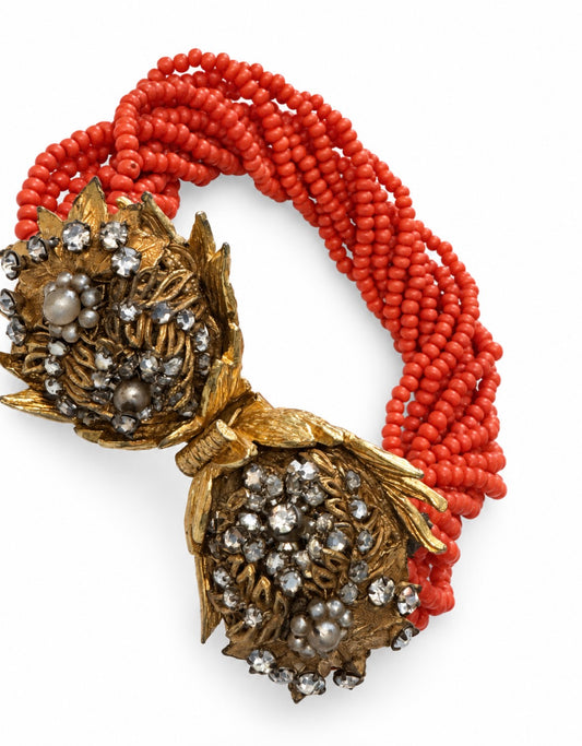 Beautiful unsigned Miriam Haskell bracelet featuring coral colored beads and gorgeous hand-wired closure.