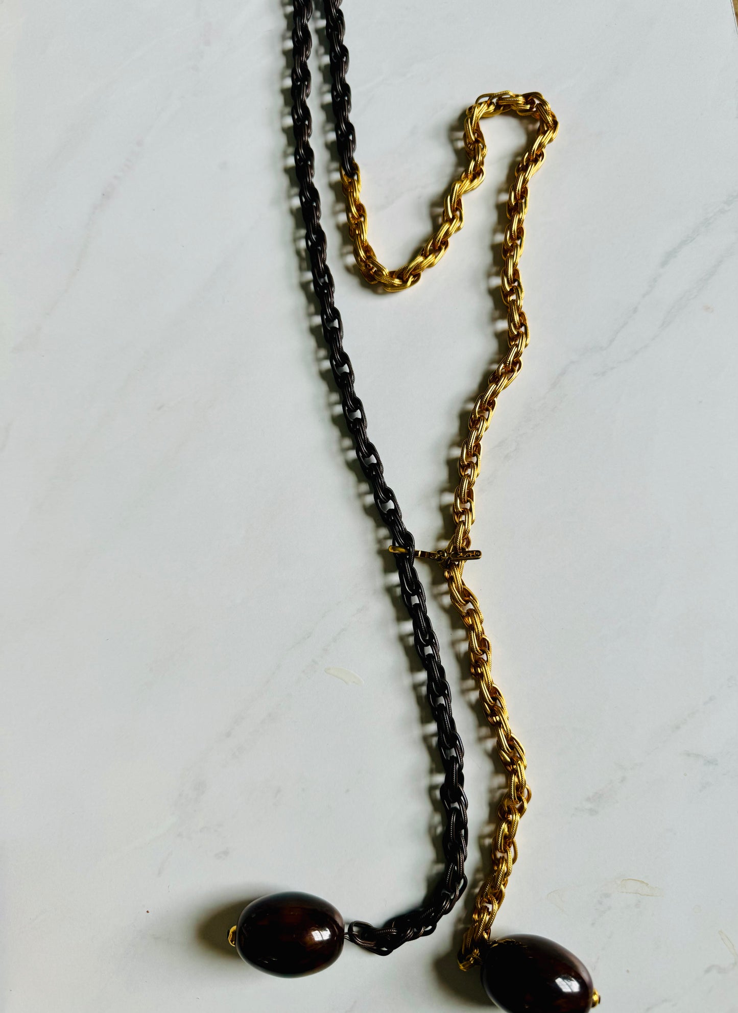 Gorgeous 1970s YSL necklace with rope chain Half gold tone, half brown. A collectors delight