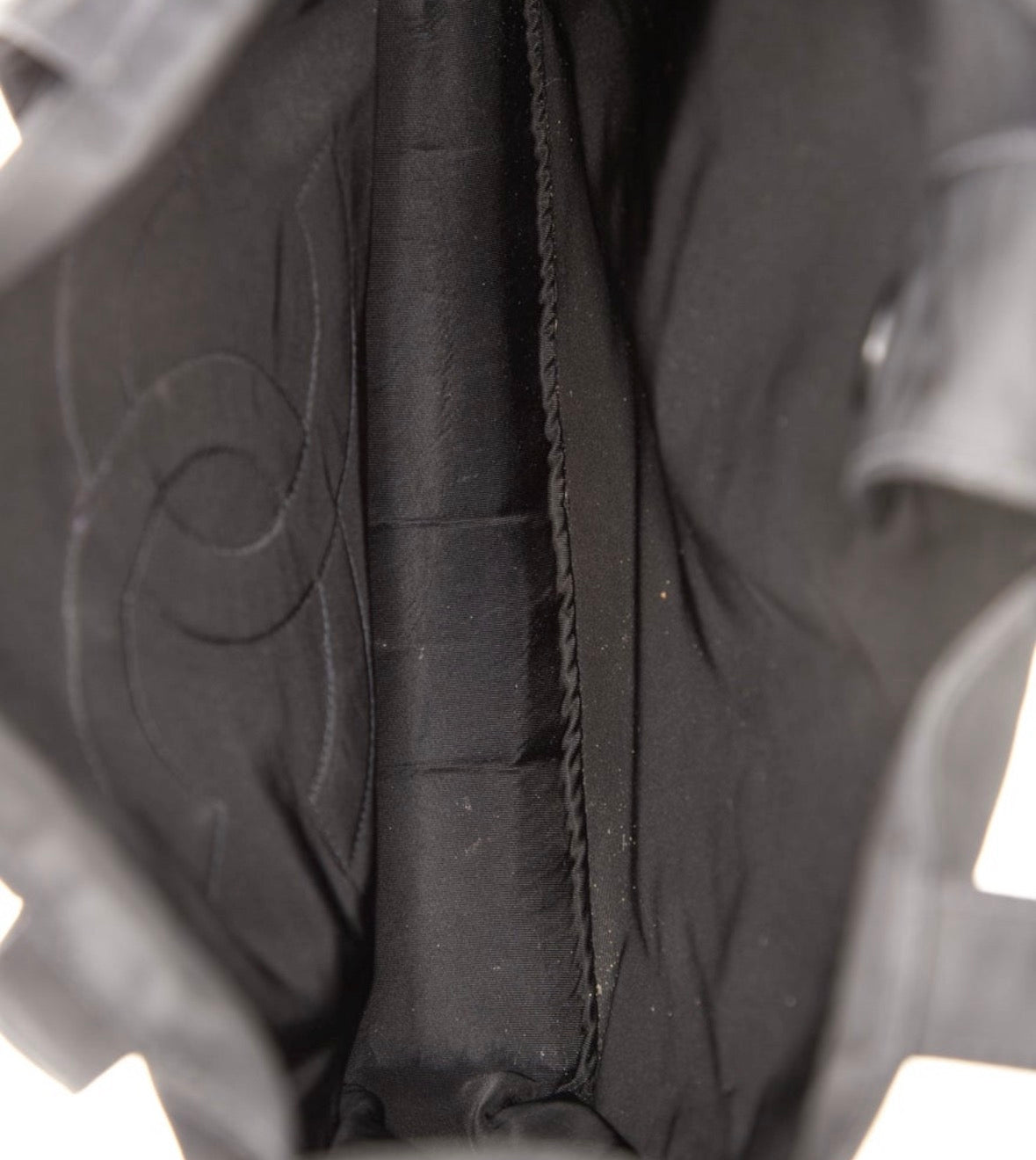 Early 2000 Karl  Lagerfeld era Chanel nylon black tote. See pictures for slight pull on front