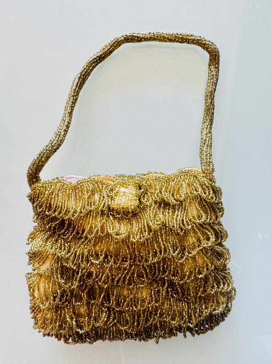 Chic gold beaded fringe bag with yellow satin lining