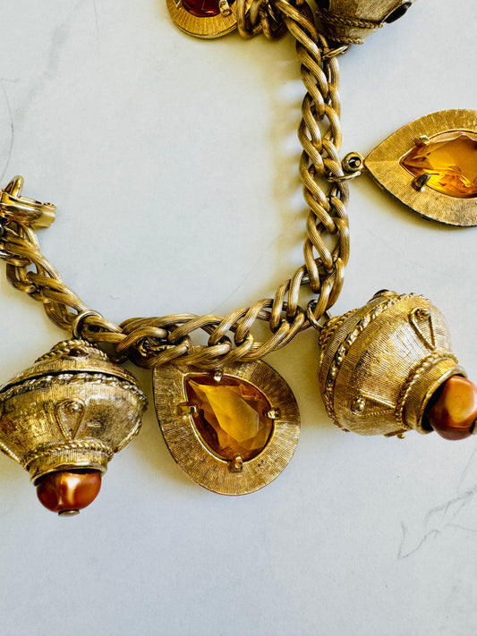 Vintage 1950s jumbo charm bracelet. Gold tone with amber charms