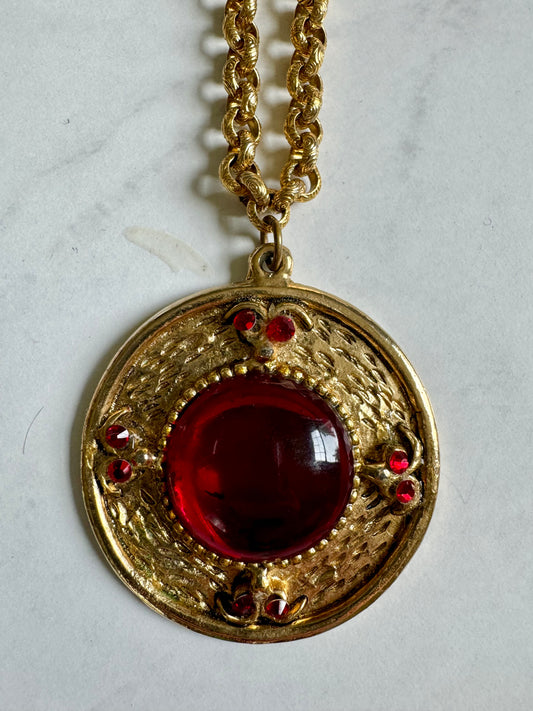 Gorgeous gold tone pendant necklace with red stone