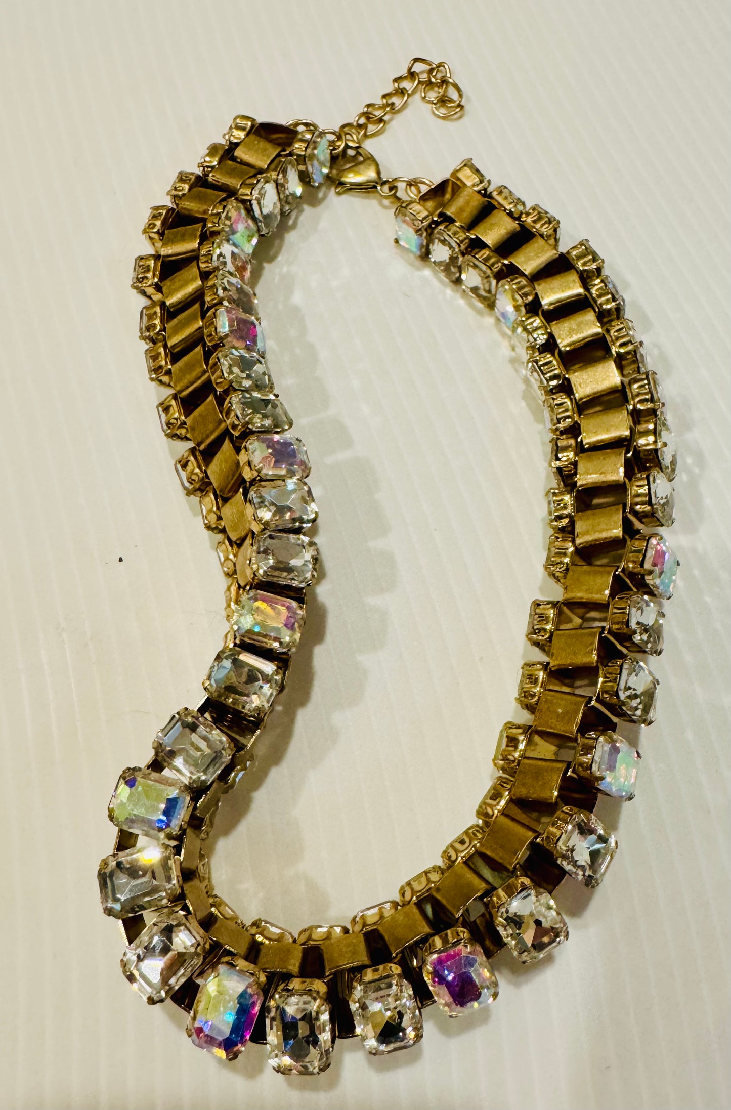 Very cool 1980s gold tone with rhinestone necklace. rhinestones are placed on the inside and outside of the gold link chain