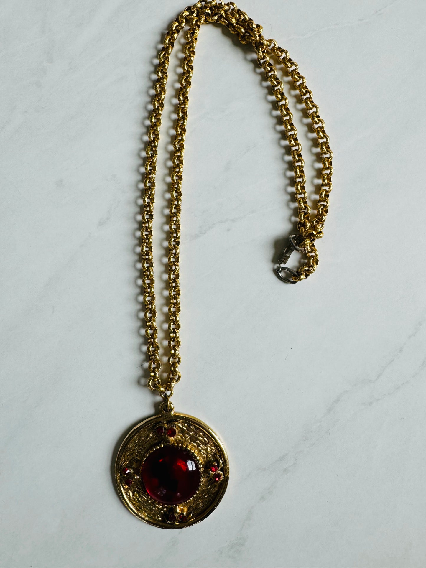 Gorgeous gold tone pendant necklace with red stone