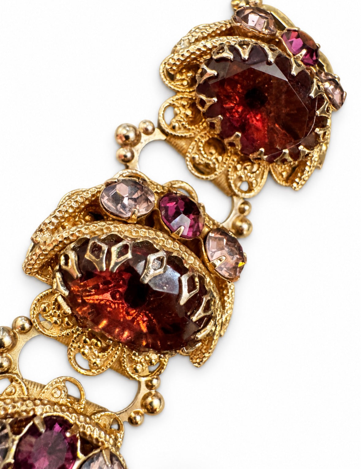 Beautifully crafted 1940s "book chain" individually prong set rhinestone bracelet with light amber and amethyst stones
