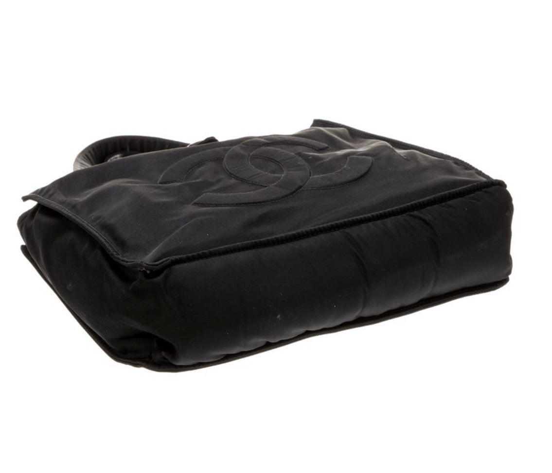 Early 2000 Karl  Lagerfeld era Chanel nylon black tote. See pictures for slight pull on front
