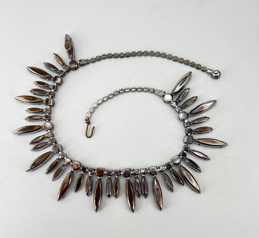 Vintage Hattie Carnegie Signed Fringe Aurora Borealis Blue Rhinestone Necklace. Long 1” Navettes alternate with shorter 1/2” Navettes, studded with various sized Chatons all in matching AB blue color.