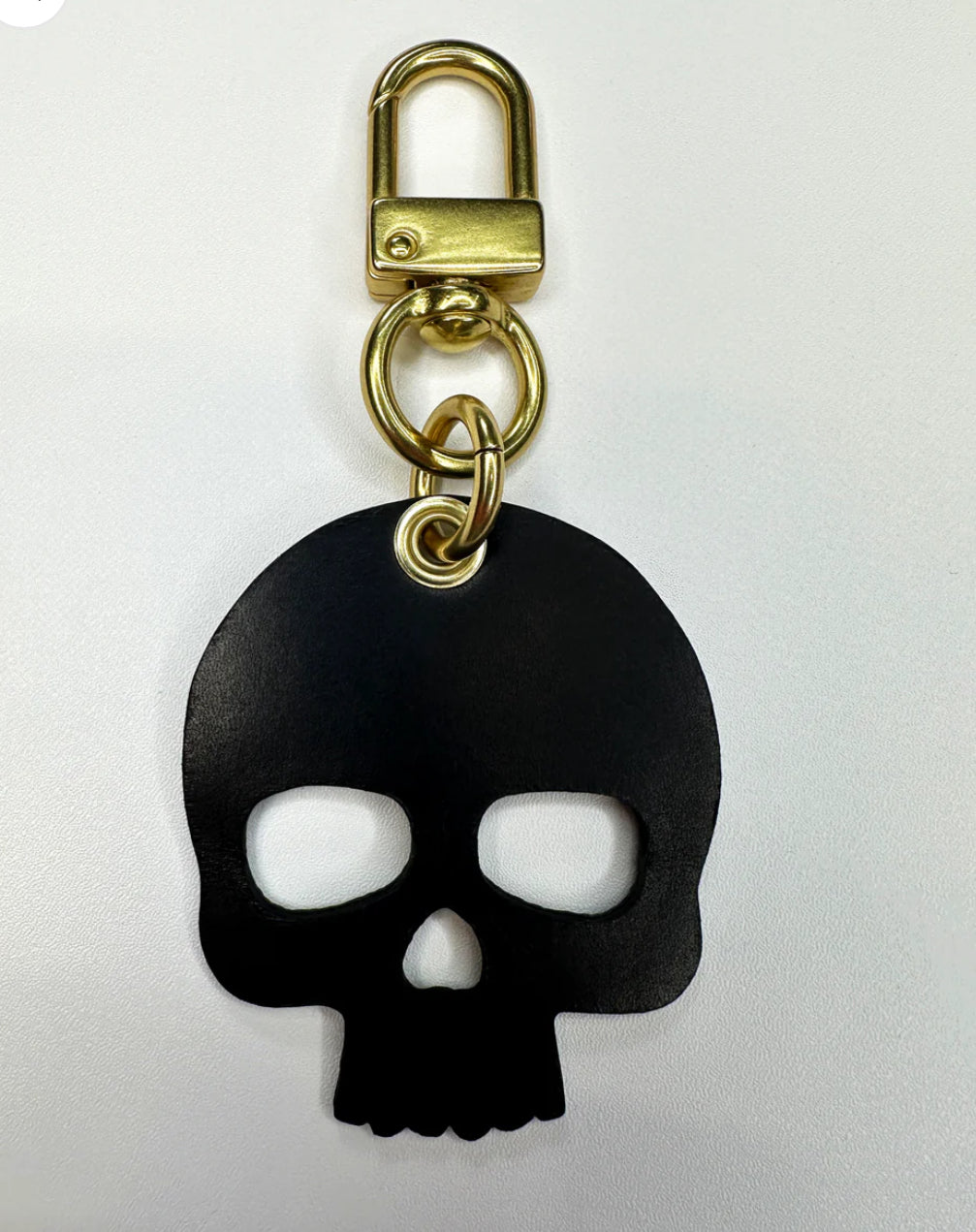 Upcycled authentic Louis Vuitton made into bag charms/key rings. Choose black or red backing. Brass hardware.