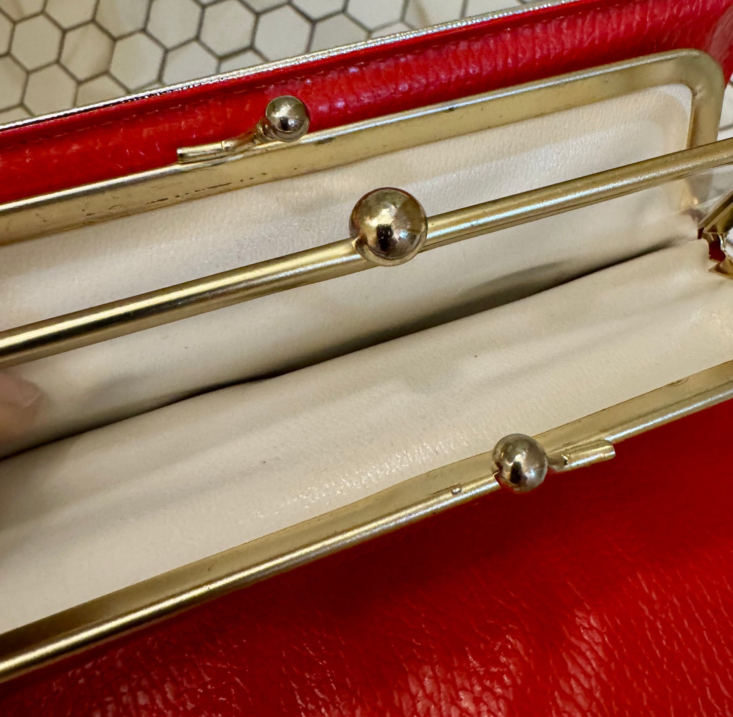 Vintage 1960s kiss lock silver clutch with red leather lining