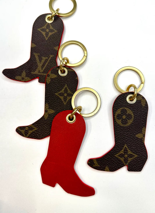 Upcycled authentic Louis Vuitton made into boot key rings. Choose black or red backing. Brass hardware.